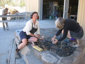 Mosaic artist, Helen Bodycomb, putting the finishing touches to the Victorian memorial at Castlemaine